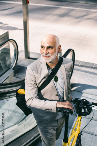 Well-Groomed Older Man Commuting to Work