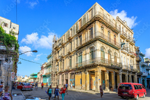 Havana Cuba Typical collection of old vintage colored houses in downton with a sunny blue sky. © Brice