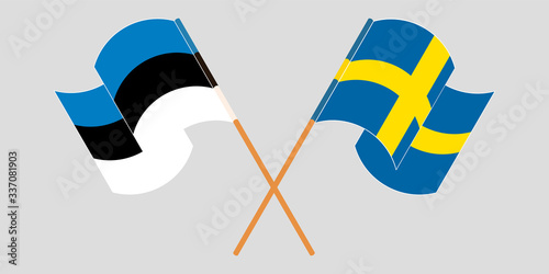 Crossed and waving flags of Estonia and Sweden