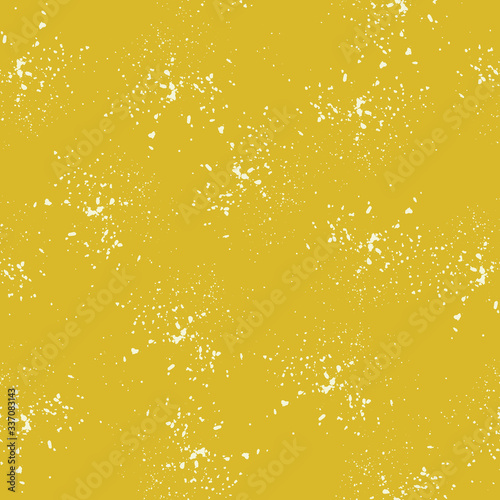 Seamless pattern, white dots randomly scattered on a yellow background. Spray texture. Vector.