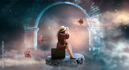 Young lady woman in retro dress and hat sitting on suitcase and flies on ammonite fossil through space and universe, idyllic fantasy scene with ghost arch ruins and butterflies, travel around world.