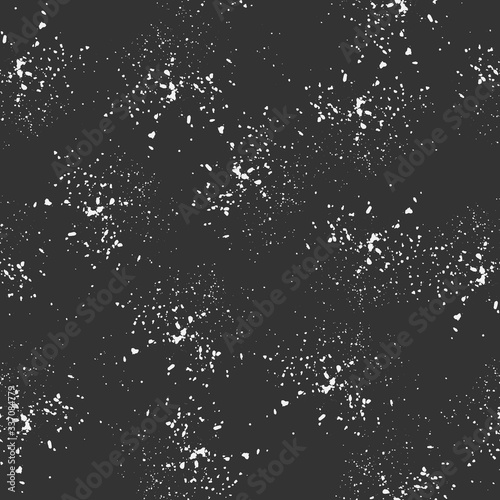 Seamless pattern, white dots randomly scattered on a dark background. Spray texture. Vector.