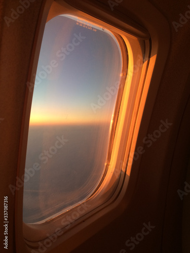 sunset from the plane window. orange sunset. sunset from the plane window