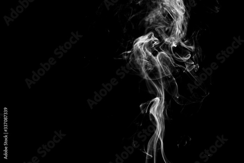 Fototapeta Naklejka Na Ścianę i Meble -  Picture of white cigar smoke in black view