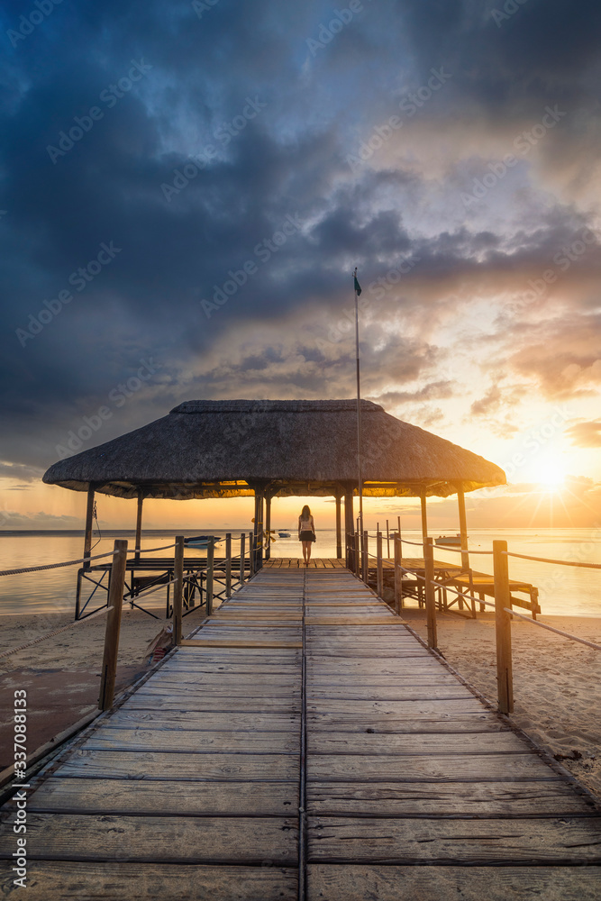 Watching Sunset at Flic en Flac, Mauritius Watching Sunset at Flic en Flac, Mauritius