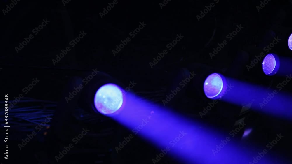 Stage Ray Of Light In Concert Hall. Lighting lamp rays shiny dynamic effect. Laser lights on the stage.  Professional lighting and show effects.Professional lighting and show effects.