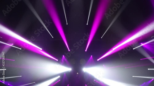 Stage Ray Of Light In Concert Hall. Lighting lamp rays shiny dynamic effect. Laser lights on the stage.  Professional lighting and show effects.Professional lighting and show effects.