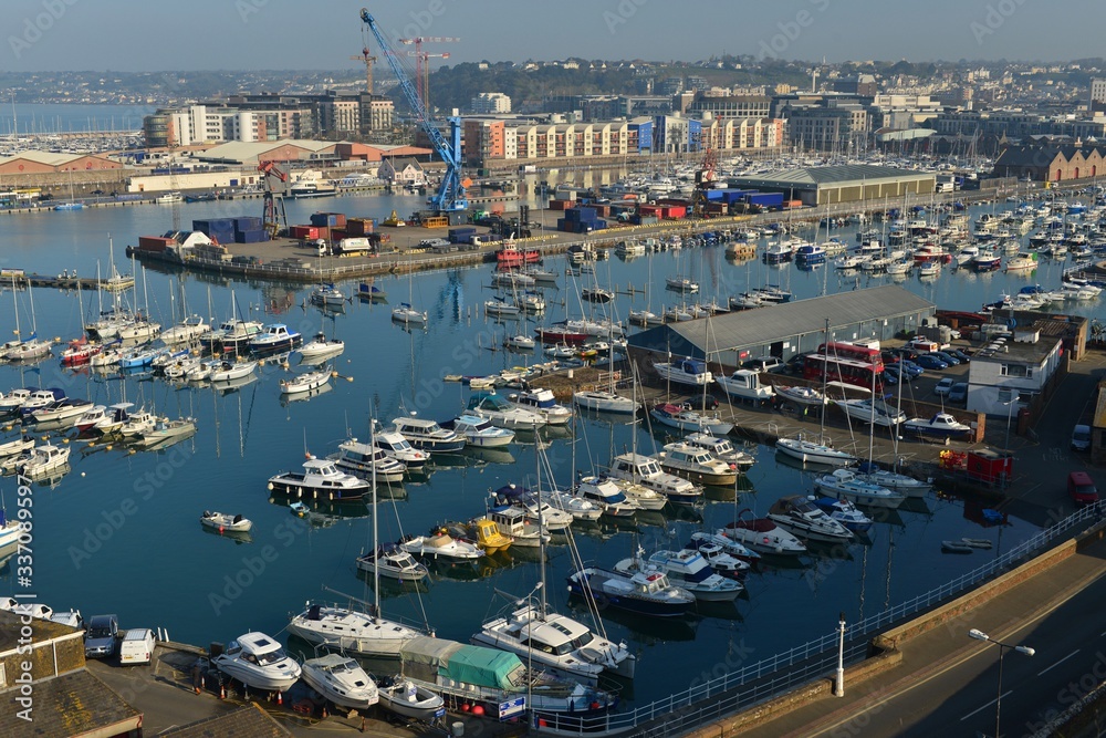 St Helier harbour, Jersey, U.K. The islands port and capital with a high Spring tide.