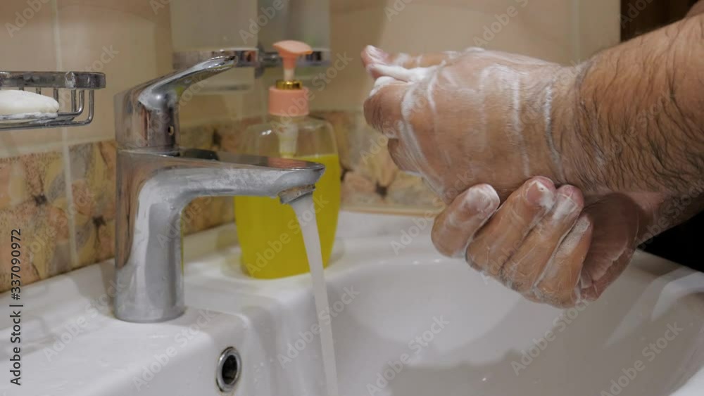 Elderly Man Washes His Hands Properly And Thoroughly With Soap To Protect Virus Elderly Man Washes His Hands Properly And Thoroughly With Soap To Protect Virus