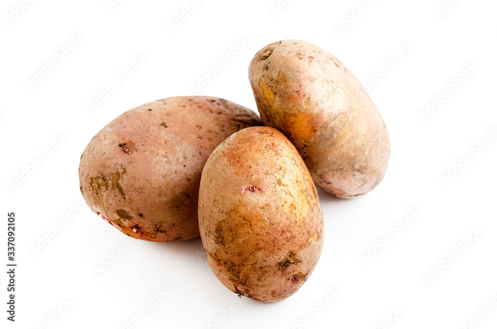 Three potatoes isolated on a white background. Three potatoes isolated on a white background.