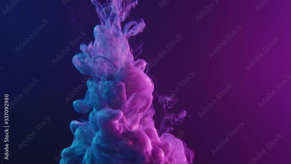 Ink water splash. Supernatural explosion. Pearl fluid cloud in purple blue neon light.