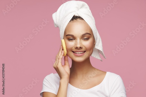 young woman with towel on head
