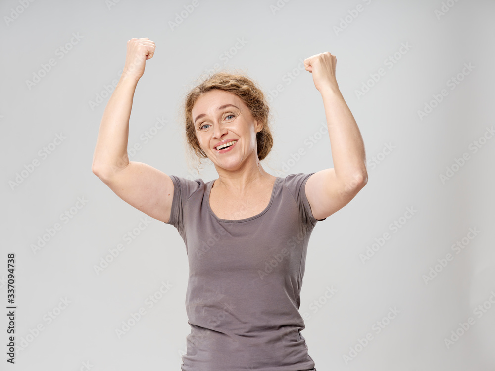 young woman with arms raised young woman with arms raised