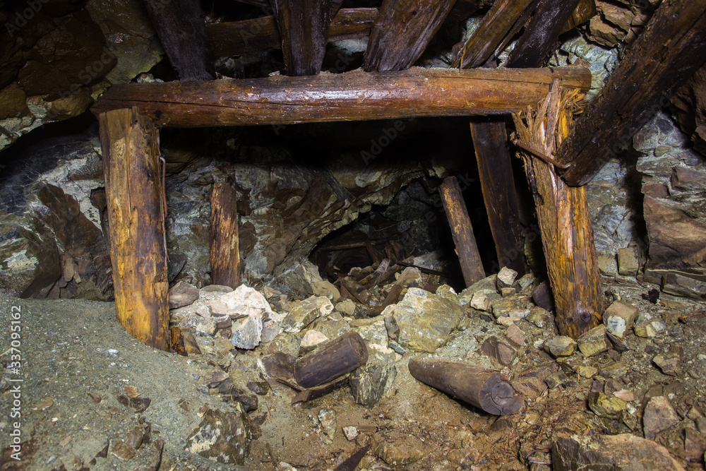 Underground abandoned platinum ore mine tunnel collapsed wooden timbering