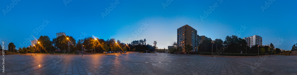 Panorama of city square at blue hour