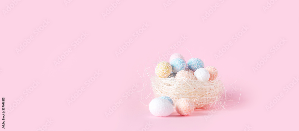 Easter flat lay background of colorful eggs on a pink background, Easter pattern top view with copy space. Easter flat lay background of colorful eggs on a pink background, Easter pattern top view with copy space.