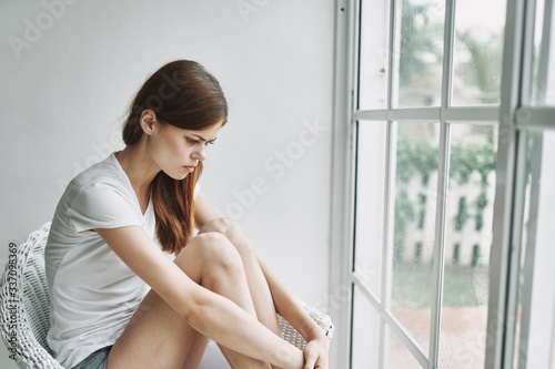 young woman looking out window Free Download young woman looking out window - GFXLoad