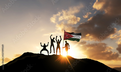 A group of people celebrate on a mountain top with Jordan flag. 3D Render