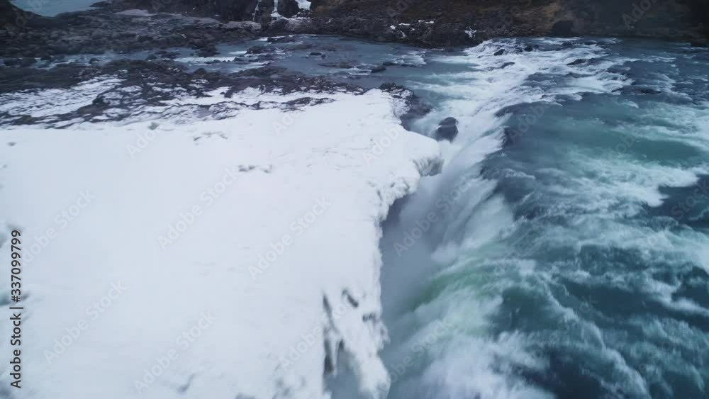 Flowing waterfall in Iceland, aerial Flowing waterfall in Iceland, aerial