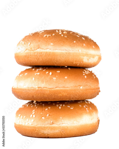 Three hamburger buns with sesame isolated on white background.