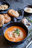 Creamy Sweet potato soup topped with Pecorino cheese, roasted cashew nuts and fresh thyme