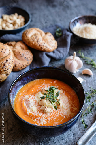 Creamy Sweet potato soup topped with Pecorino cheese, roasted cashew nuts and fresh thyme