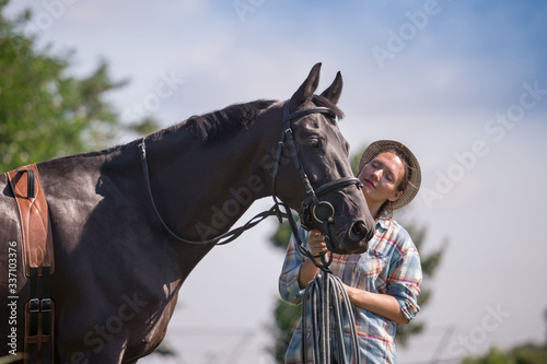 Woman and horse, landscape, green field