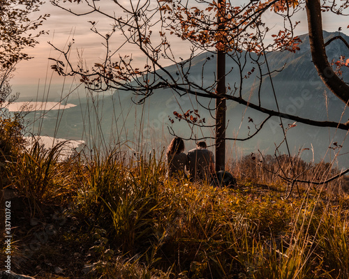 Sunset view from Monte Barro,Relaxing on top of a small mountain with lake and clouds Oct-27-2019 photo