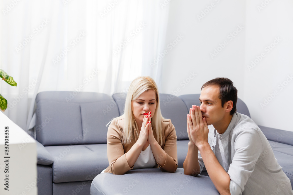 woman and man pray at home woman and man pray at home