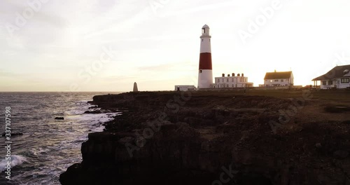 Portland Bill Lighthouse in England at sunset, aerial