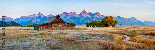 Panorama of the historic mormon barn in front of the Grand Tetons at sunrise, Grand Teton National Park, Wyoming