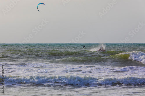 Surfers ride the waves on t...