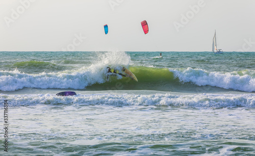 Surfers ride the waves on t...