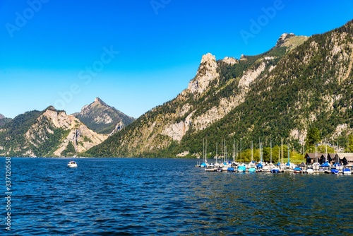 View on Traunsee, Lake Traun from Ebensee with boats, sailboat, sailboats, alps mountains nearby Traunkirchen, Bad Ischl. Salzkammergut, Oberosterreich, Upper Austria. photo