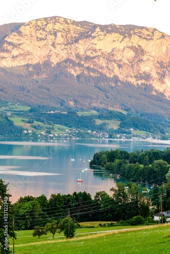 Beautiful view on Attersee lake im Salzkammergut, alps mountains, boats, sailboats, sailboat by Stockwinkl, Parschallen, nearby Nussdorf, Zell. Upper Austria, nearby Salzburg. photo