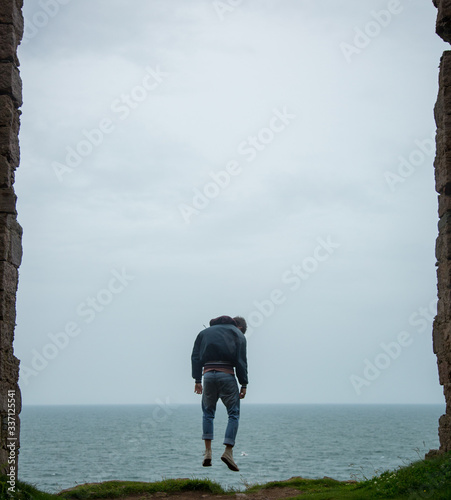 Model levitating near ocean