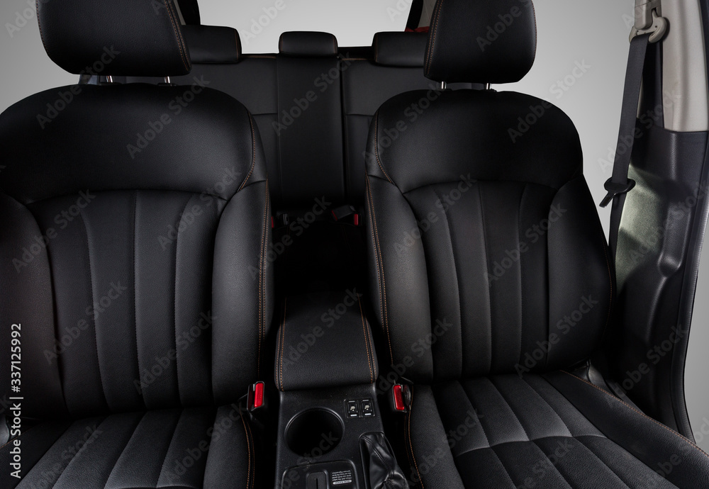 Fototapeta premium the interior of the car is covered with handmade genuine leather. The General plan of the interior of the car. View from the windshield. The back doors are cut from the photo. High-quality stitching