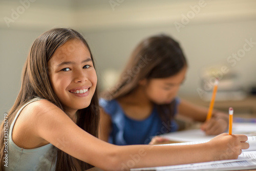 Young Girls Working On Their School Work