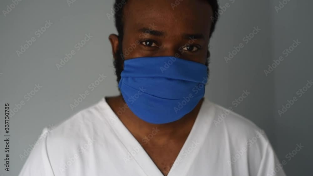 Black african american man doctor in medical mask. Coronavirus is around. People who saves themselves. Pandemic. Black african american man doctor in medical mask. Coronavirus is around. People who saves themselves. Pandemic.
