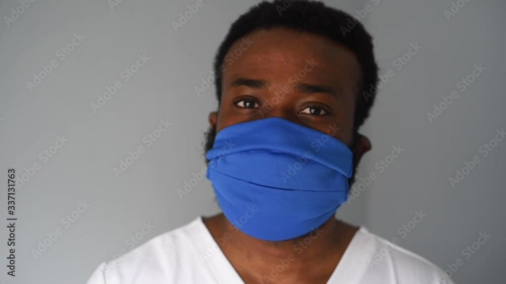 Doctor in mask. Black man african american doctor portrait wearing safety mask at work. Medical staff. Coronavirus. Doctor in mask. Black man african american doctor portrait wearing safety mask at work. Medical staff. Coronavirus.