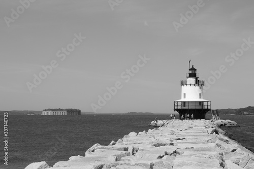 lighthouse on the shore of the sea
