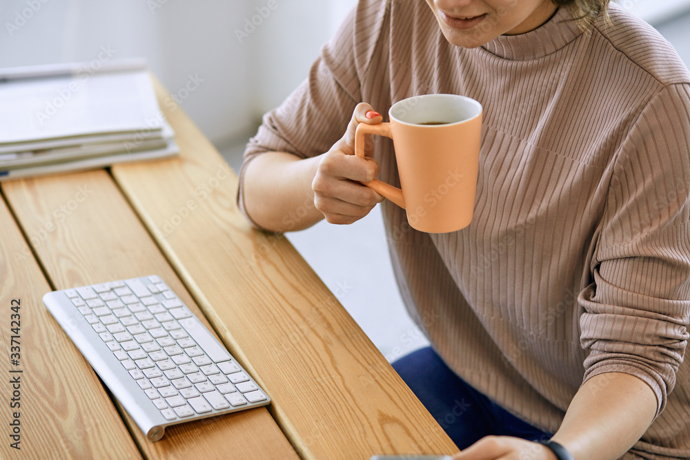 Young woman working with graphic tablet in office Young woman working with graphic tablet in office