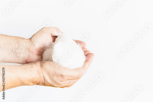 a man hands and soap bubble cleaning hands wash off germs virus plain white background