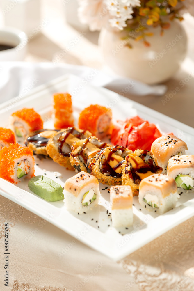 close up of sushi rolls served with wasabi and ginger close up of sushi rolls served with wasabi and ginger