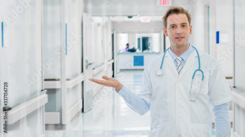 portrait of caucasian male medical doctor with stethoscope in hospital