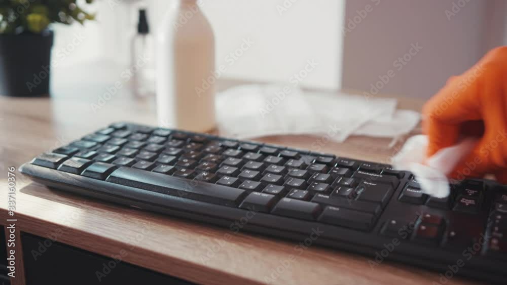 Hands disinfecting laptop keyboard with antiseptic spray and wet wipe in gloves virus antibacterial pandemic stay at home laptop sanitary infection clean sanitizing precaution coronavirus Hands disinfecting laptop keyboard with antiseptic spray and wet wipe in gloves virus antibacterial pandemic stay at home laptop sanitary infection clean sanitizing precaution coronavirus