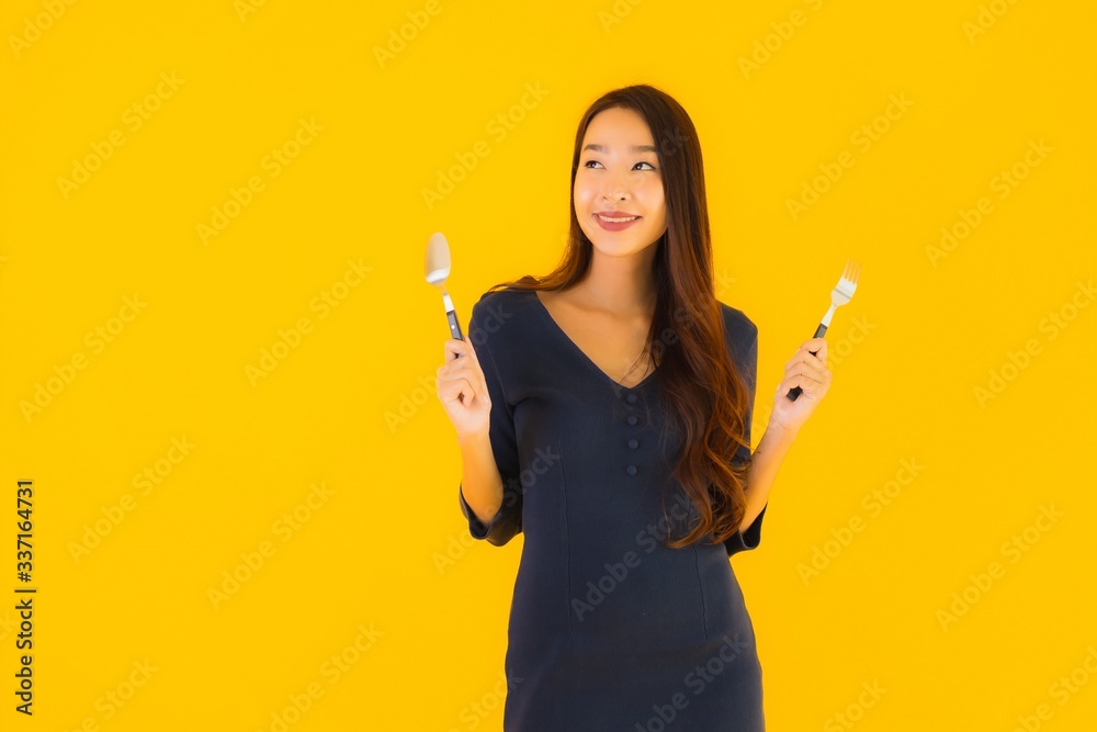 Portrait beautiful young asian woman with spoon and fork Portrait beautiful young asian woman with spoon and fork