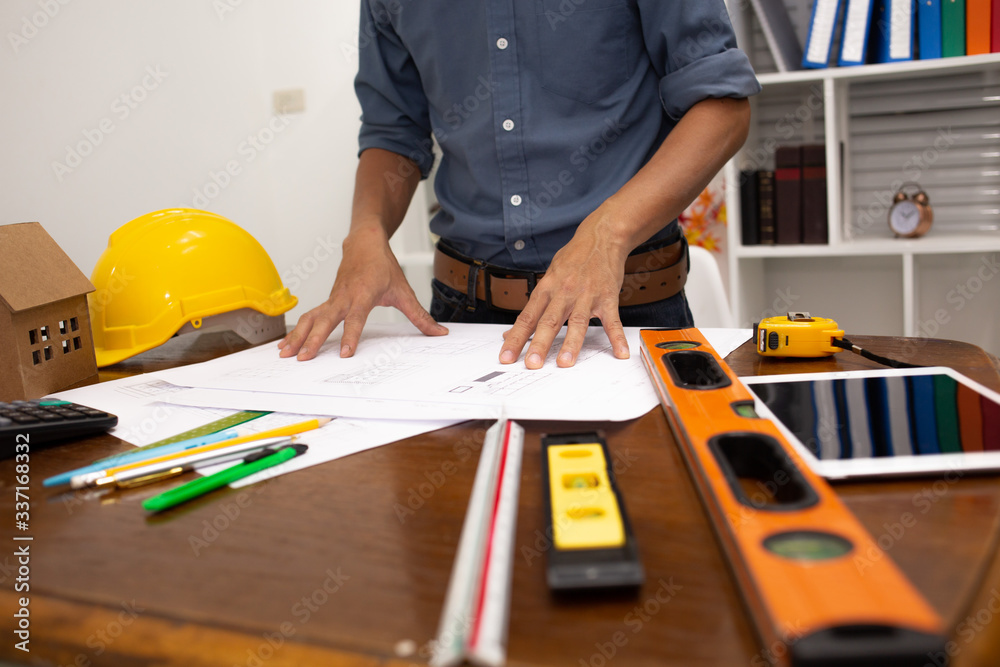 Engineers are working with architects to agree on a residential construction project.concept Engineers are working with architects to agree on a residential construction project.concept