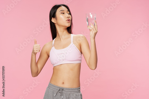 young woman holding a bottle of water © SHOTPRIME STUDIO