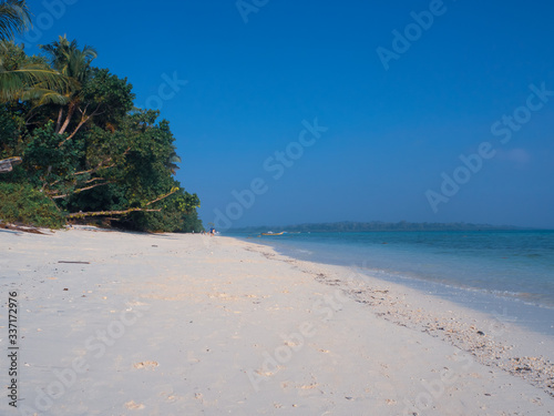 White sandy Govind Nagar beach in the Andaman Islands  India under a clear blue sky